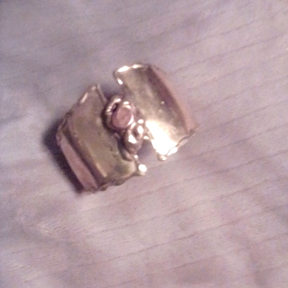 Gold colored cuff bracelet.